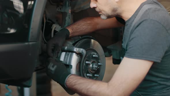 Selective Focus Disc Brake on Car Car Brake Repairing in Garage alt