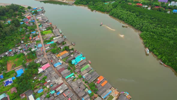 Aerial Shot of Local Fisherman Village Beside the sea. alt
