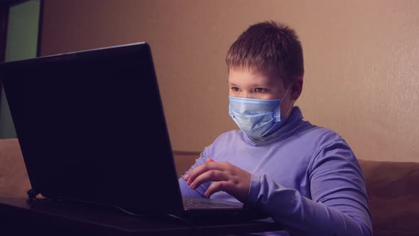 A Child Learns Online From Home Watching a Lesson Listening to the Teacher alt