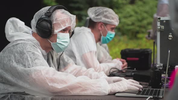 A team of filmmakers at work. Compliance with antiviral safety measures during the quarantine.  alt