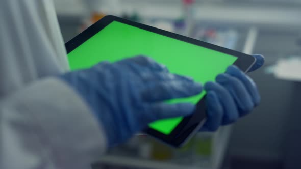 Doctor Hands Working Chroma Key Tablet Closeup Touching Screen with Gloves alt