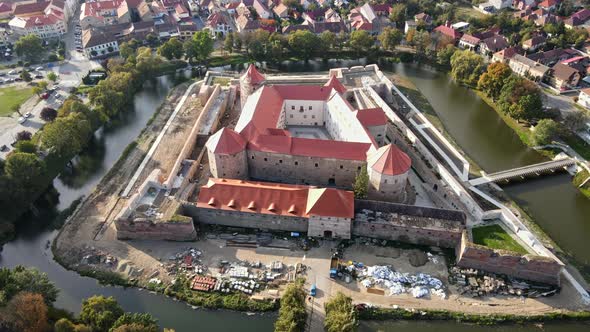 Aerial drone view of the Fagaras, Romania. Fagaras Citadel surrounded by a moat alt