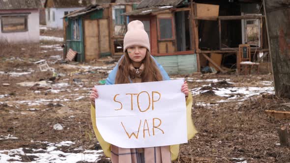Upset Ukrainian poor girl kid protesting war conflict raises banner with inscription massage text St alt