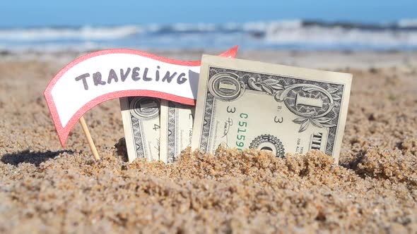 Paper Bills One Dollar and Small Stick Paper Speech Bubble with Word Traveling alt