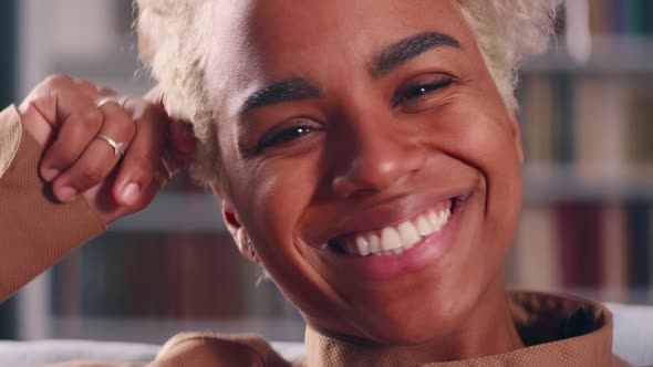 Close Up African American Female Looking at Camera Showing Whitening Smile alt