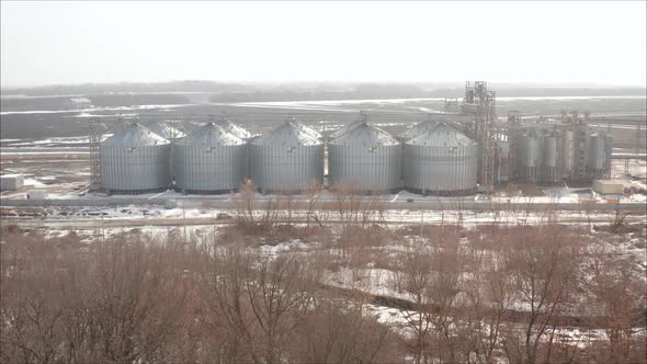 Industrial Elevator on the Background of a Winter Field alt