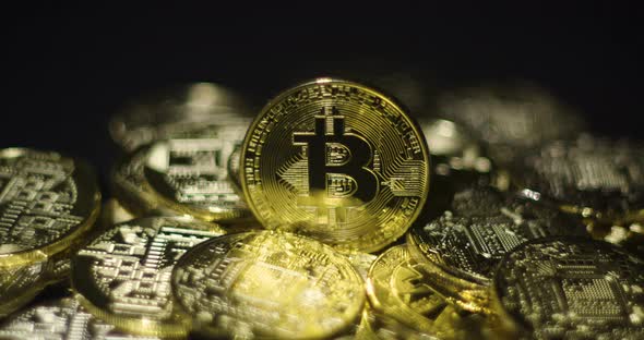 Cryptocurrency Real Golden Coins With Bitcoin Logo On Black Background