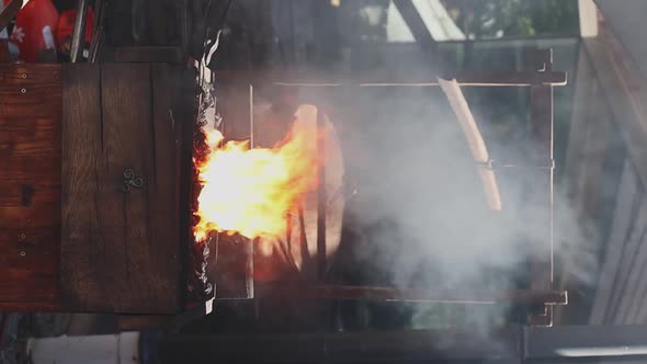 Blacksmith of the medieval era forges iron.