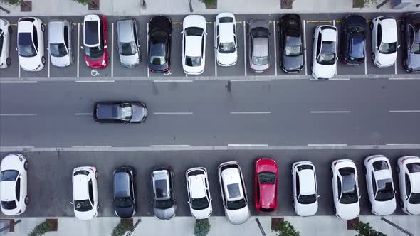 aerial top view of street on both sides car park and lot of car parked by ucarer