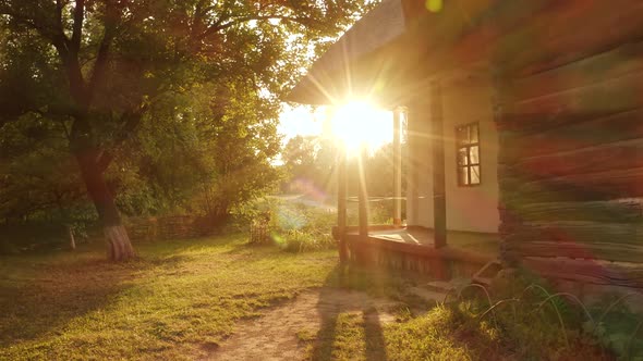 Landscape of Old Hut House Garden and Bright Sunshine Rays alt