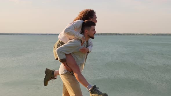 Playful Couple At Lake alt