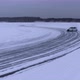 Aerial view of the rally car on a snowy road - VideoHive Item for Sale