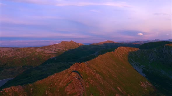 Mountains on Andoya, Norway, from air lit by midnight sun alt