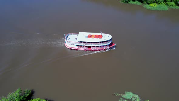 Boat sailing at Amazon River at Amazon Rainforest. Manaus Brazil. alt