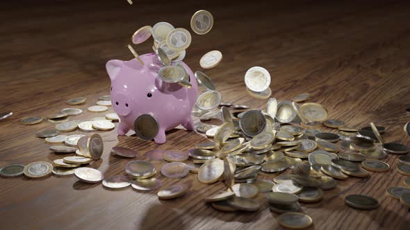 Falling Euro Coins on the Money Box Pig and Wood Floor