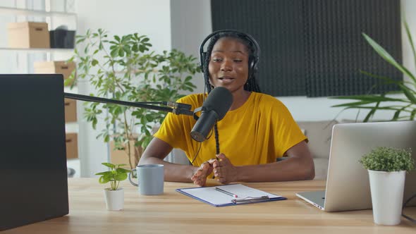 African American Streamer Speaks Into a Microphone Records Morning Radio News alt