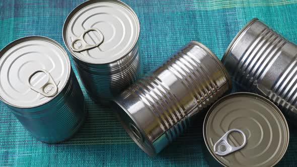 Tin cans with food. Conserved food. Closeup of a group of aluminium cans.