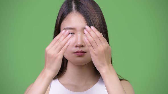 Young Beautiful Asian Businesswoman Covering Eyes As Three Wise Monkeys Concept