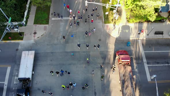 Marathon / 5K Runners at an Intersection on City Street