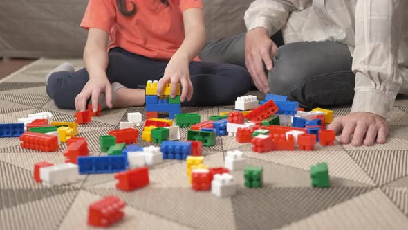 Family with colored blocks.  alt