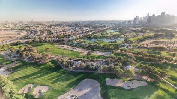 Golf Course and Jumeirah Lake Towers Skyscrapers Before Sunset Timelapse Dubai United Arab Emirates alt