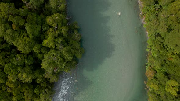Overhead aerial view of clear green river in Blue Pools in New Zealand alt