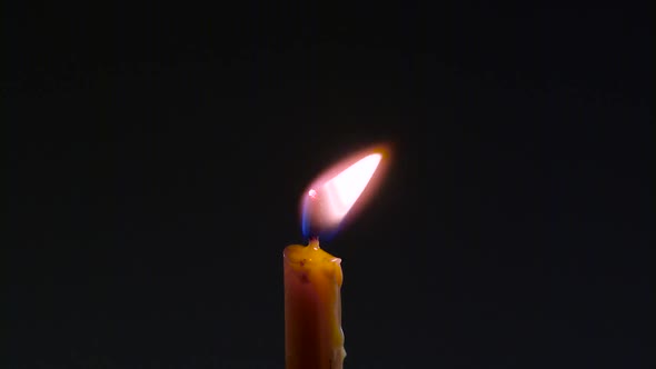 Wax Drips on a Burning Candle alt