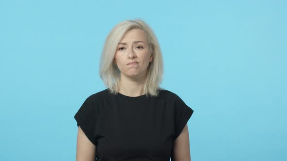 Slowmotion Unconfident Pensive Gloomy Blond Female Standing Indecisive Pouting and Frowning Having alt