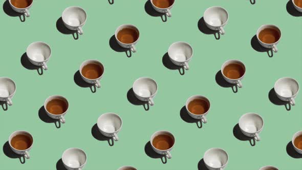 Pattern with Many Tea Cups and Empty Cups Animated on Light Green Background alt