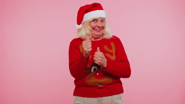 Grandmother Woman in Sweater Christmas Santa Shouting Celebrating Success Winning Goal Achievemen alt