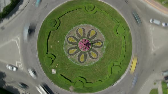 Aerial View Timelapse of Roundabout Road with Circular Cars in Small European City at Sunny Summer alt