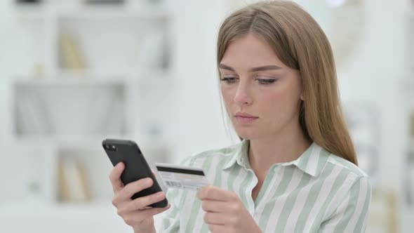 Portrait of Young Woman Making Online Payment on Smartphone  alt