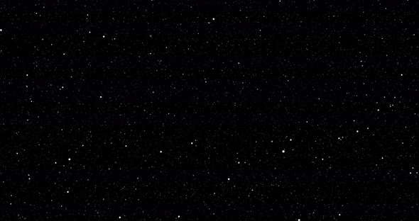 Twinkling star particles on starry black night background.