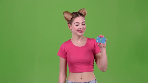 Teenager Advertises a Card and Shows a Thumbs Up. Green Screen alt
