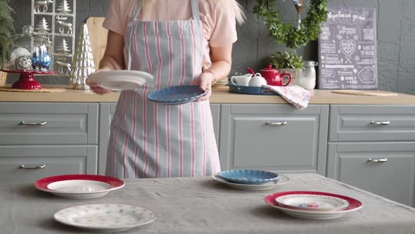 Christmas Table Decoration. Festive Table Setting. Female Hands Decorate the Table for Christmas alt