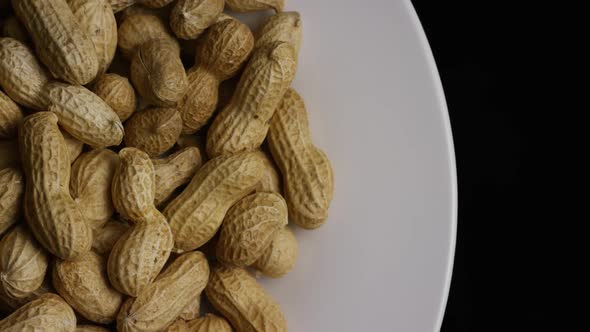 Cinematic, rotating shot of peanuts on a white surface - PEANUTS 018 alt