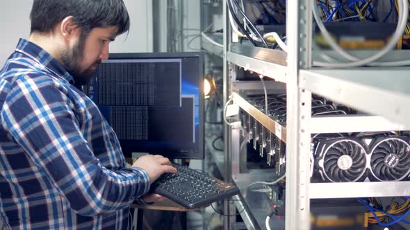A Man Works on a Computer alt