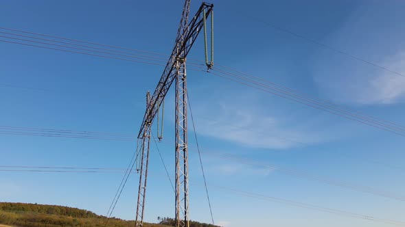 High Voltage Tower with Electric Power Lines Transfening Electrical Energy Through Cable Wires alt