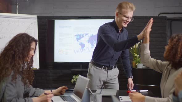Coworkers Giving High Five alt