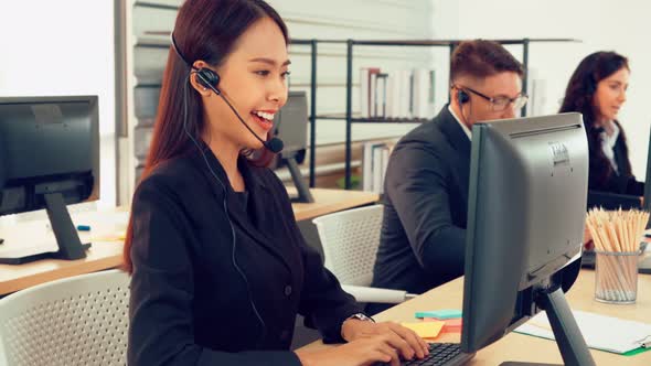 Business People Wearing Headset Working in Office alt