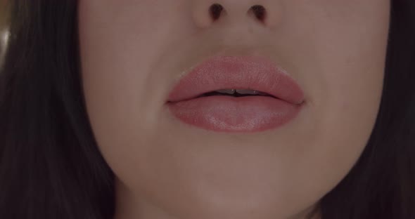 Extreme Close Up of Woman's Sexy Lips with Botox alt