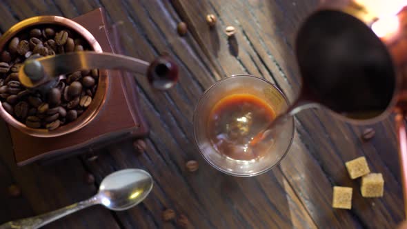 Coffee Cup with Freshly Brewed Coffee on An Old Vintage Table. alt