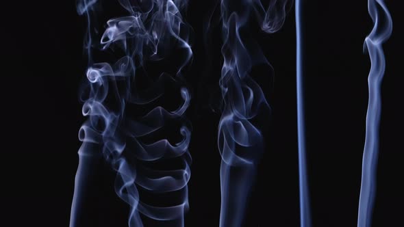 Streams of White Smoke Billowing Upward in Slow Motion alt