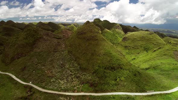 Aerial view of Chocolate hills and cloudy sky in Badian, Philippines. alt
