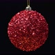 Close-Up View of Shiny Bright Red Christmas Ball Rotates on Axis, Hanging on Black Background - VideoHive Item for Sale