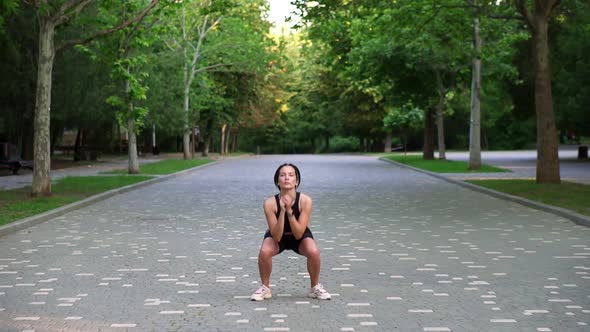 Full Length Footage of Athletic Stylish Sportswoman Doing Crossfit Bounce Jumps and Squats alt