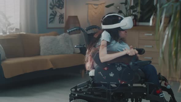Woman in Motorized Wheelchair Wearing VR Glasses alt