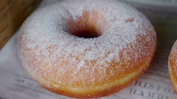 Closeup Freshly Baked Donut with Powdered Sugar alt