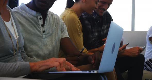 Executives using laptop alt