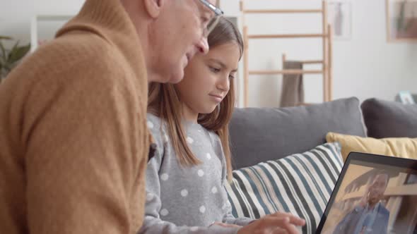 Girl and Granddad Watching Videos on PC alt